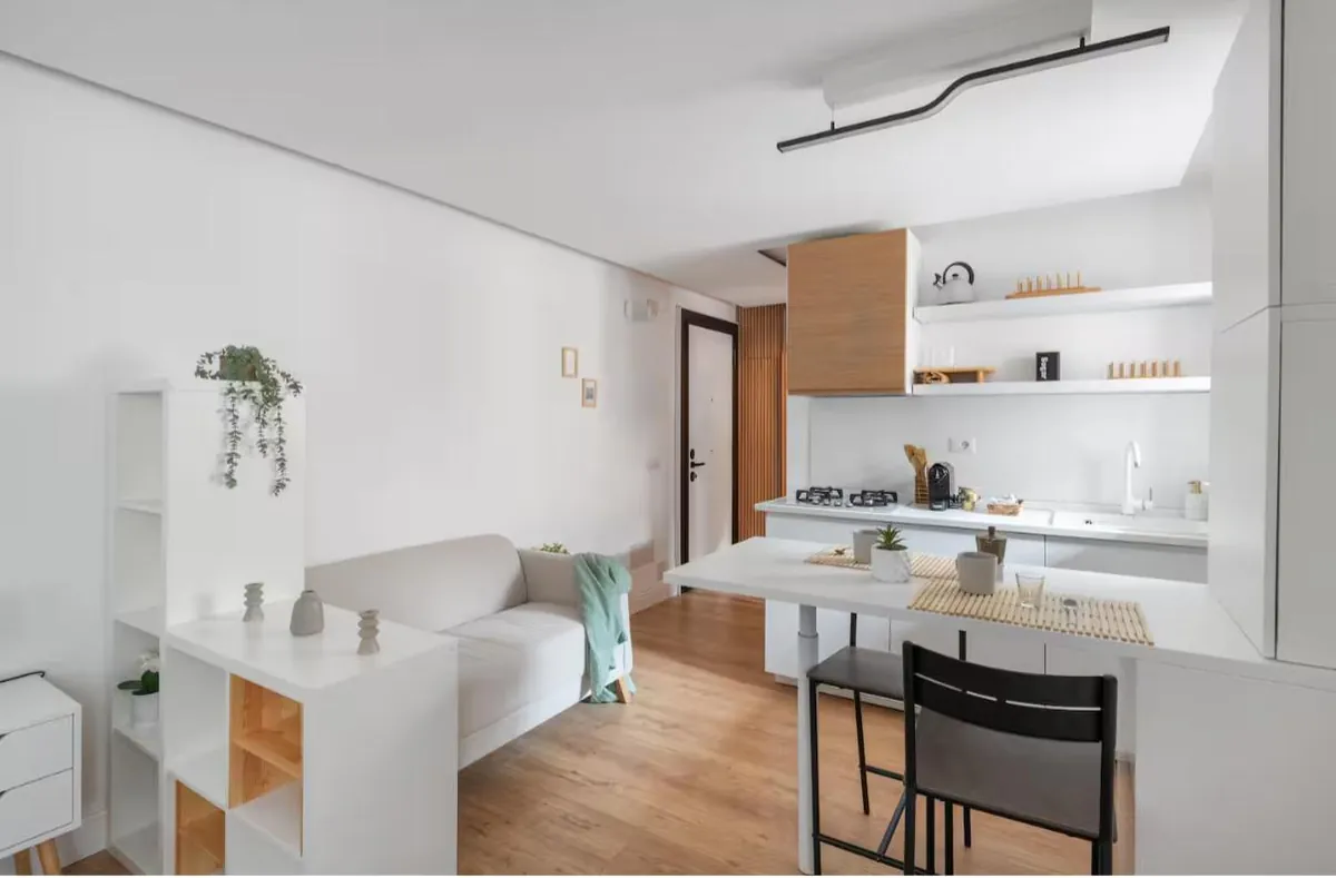 Renovated studio: kitchenette, table and sofa